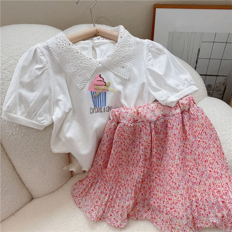 Letnia odzież dziewczęca zestawy w stylu koreańskim śliczne Hollow Lace Lapel Top + spódnica w kwiaty moda… Letnia odzież dziewczęca zestawy w stylu koreańskim śliczne Hollow Lace Lapel Top + spódnica w kwiaty moda…