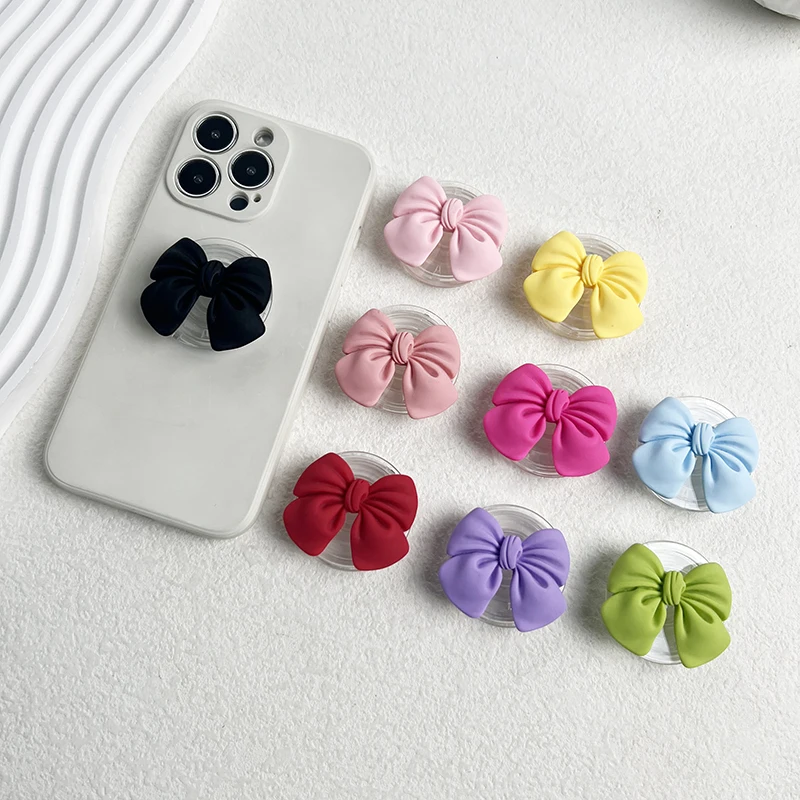 Uroczy kolorowy uchwyt na telefon z kokardką Rozszerzalny stojak na biurko Macaron Żywica Butterfly Knot… Uroczy kolorowy uchwyt na telefon z kokardką Rozszerzalny stojak na biurko Macaron Żywica Butterfly Knot…